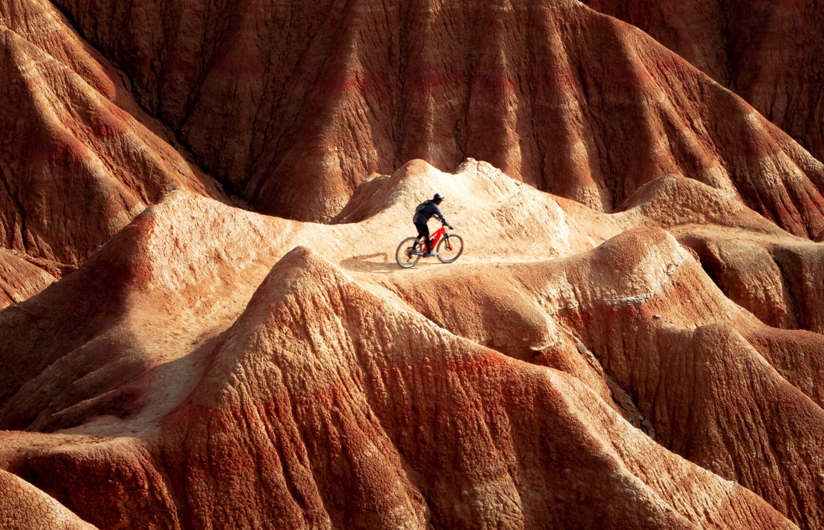 Cyclist in mountainous terrain.